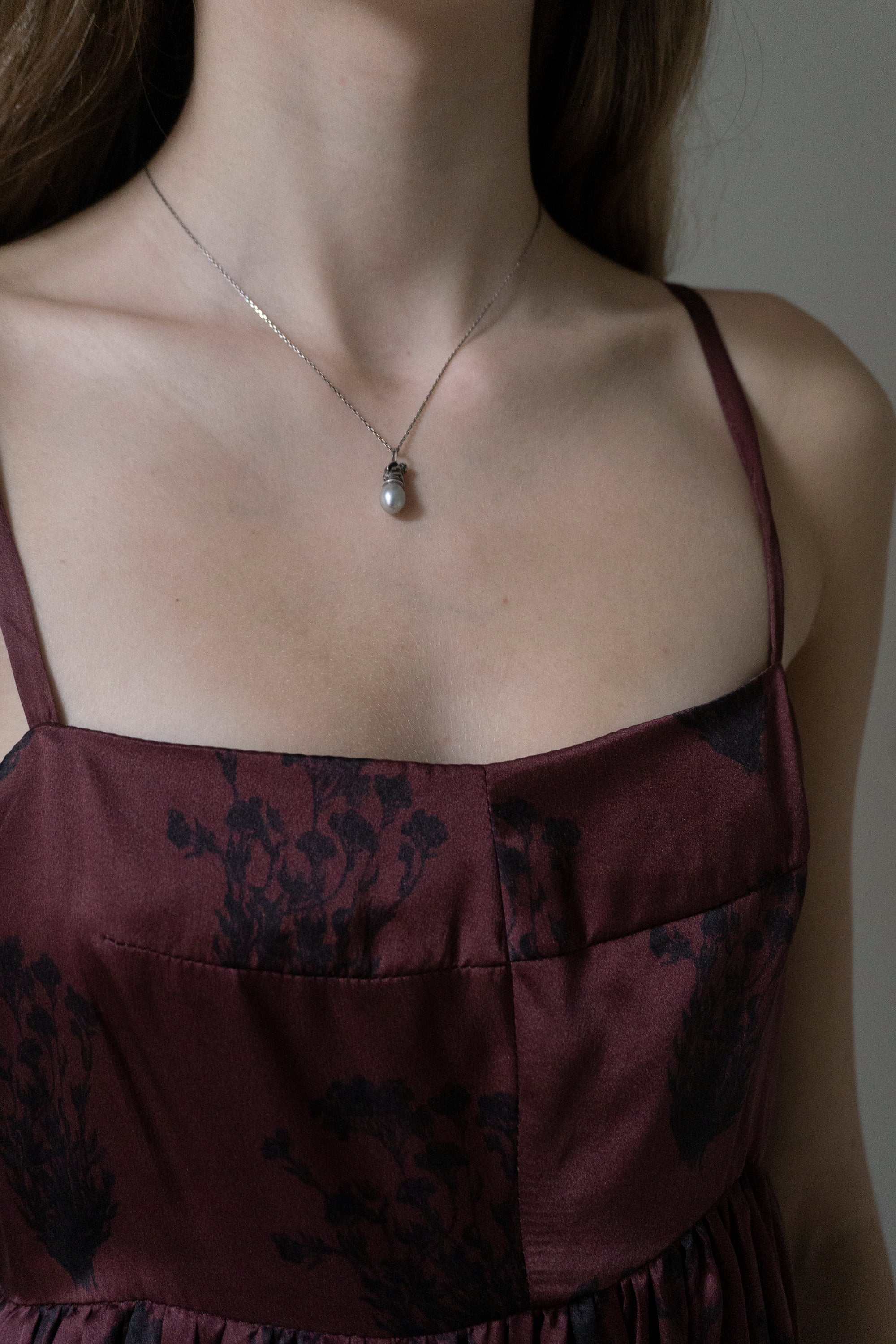 Cherub on a Pearl Necklace